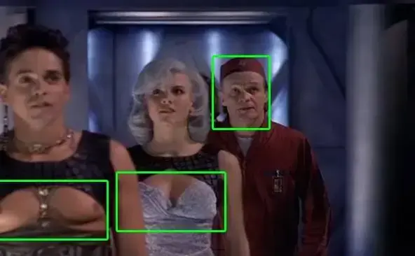 Screensot from LEXX with three characters: a man with open manboobs, a girl with a bra and an old guy in a service uniform.