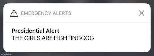 Emergency alert phone notification of a Presidential Alert that reads "The girls are fighting"